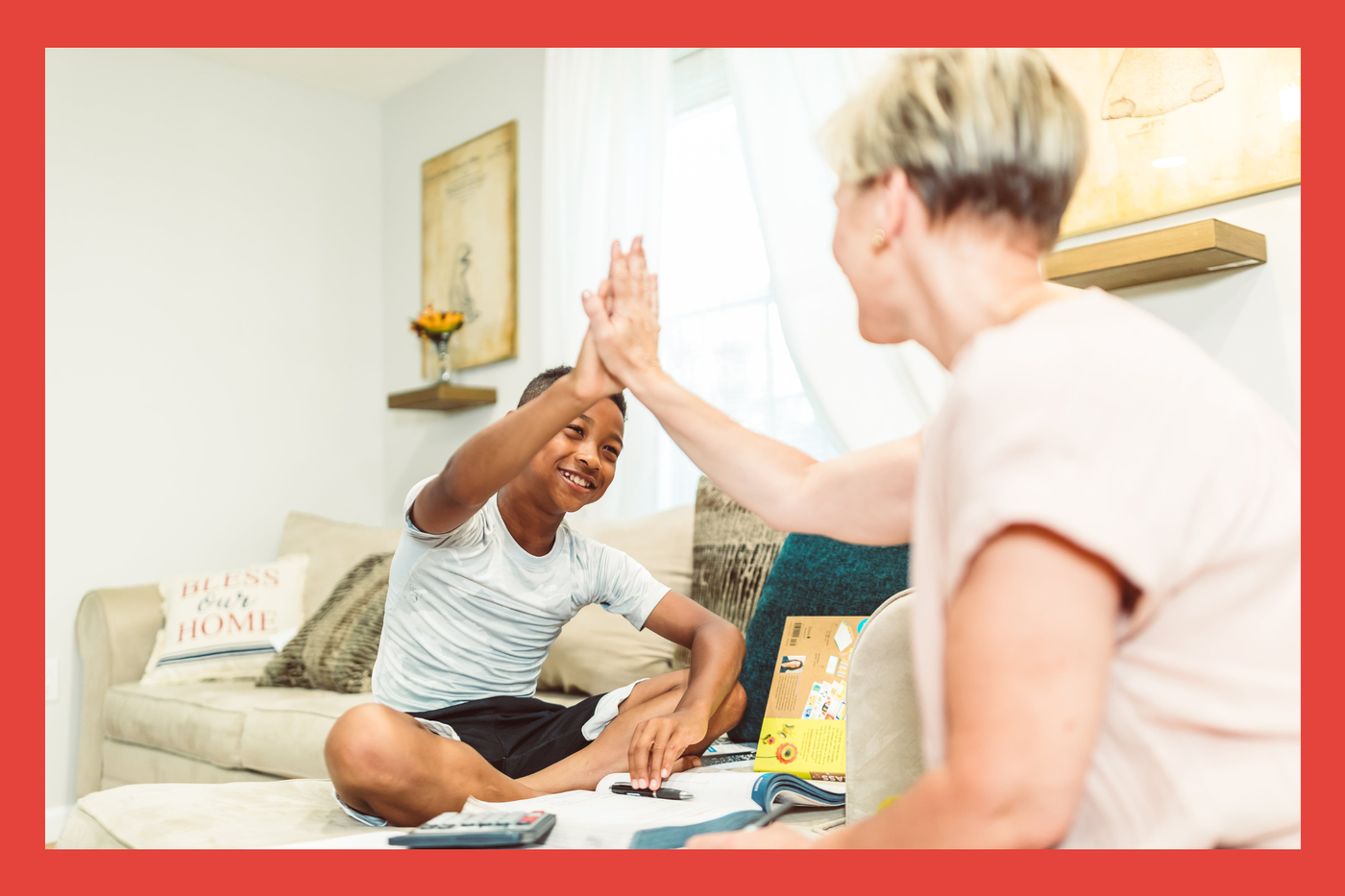 Young Boy. Middle age woman. High five. 